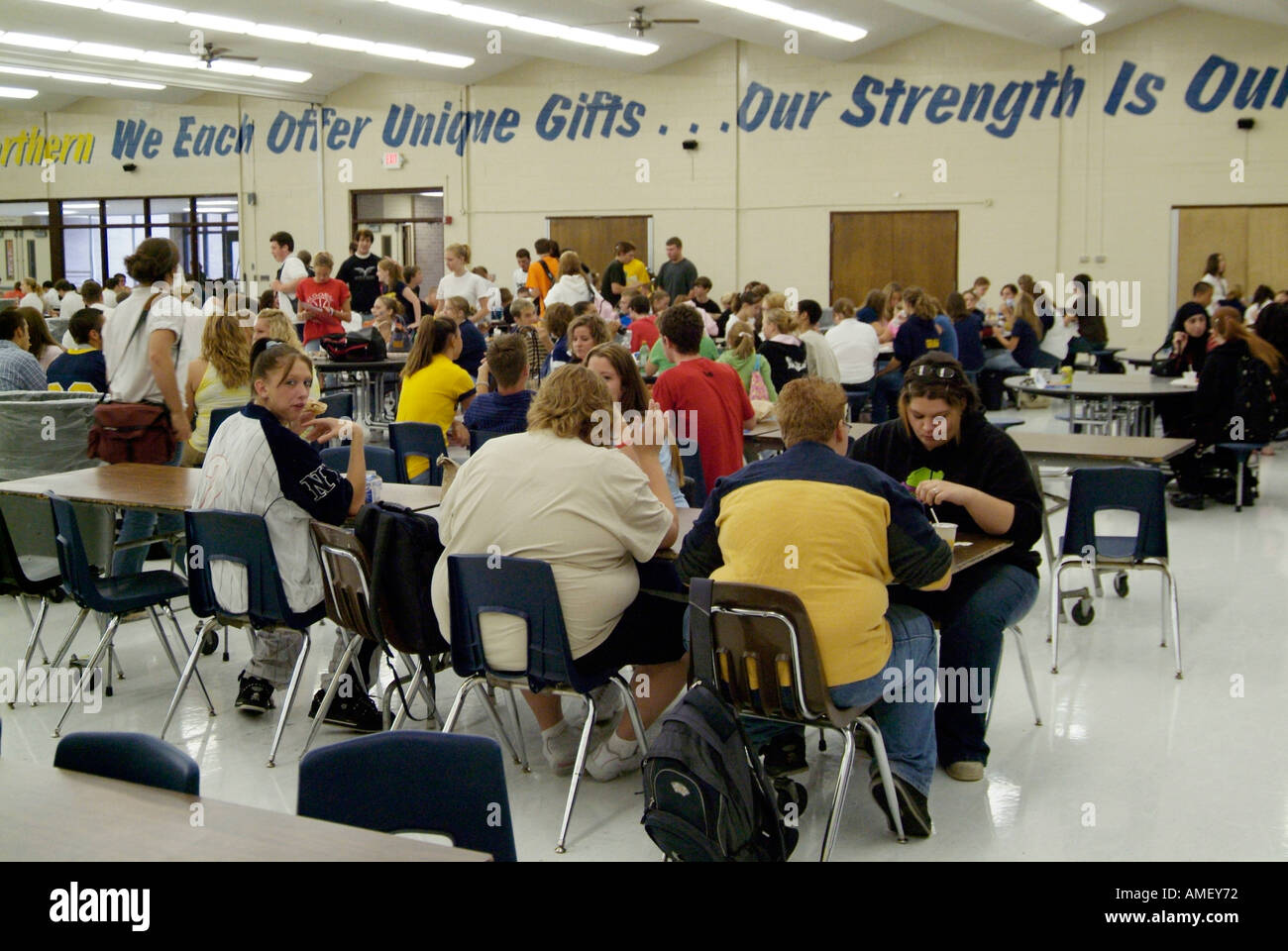 High School Cafeteria During Lunch Hour Is A Time For Eating And